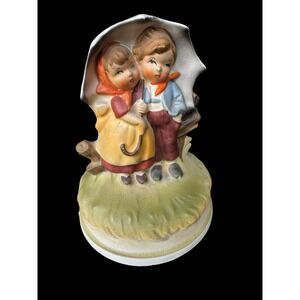 Antique porcelain musical Figurine. Made in Japan.